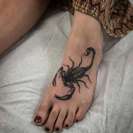 Scorpion foot tattoo