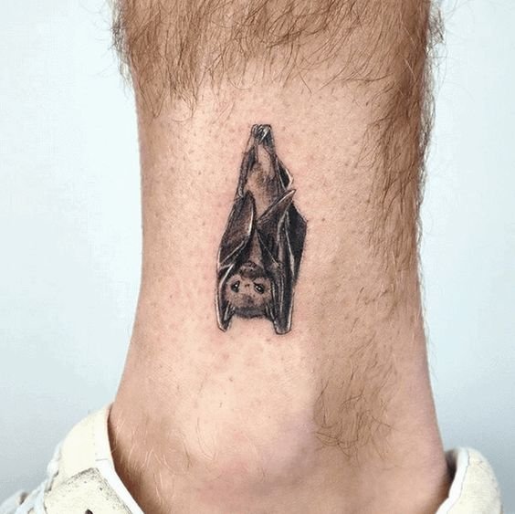 tiny bat tattoo